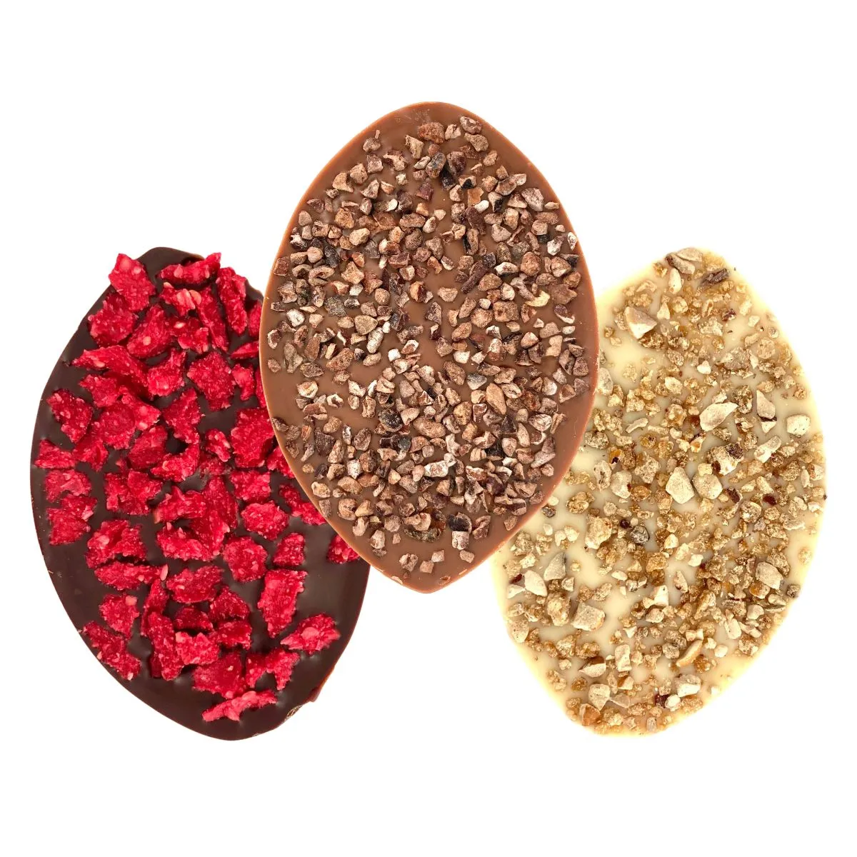 ChocoVulves – framboises, cacao et noisettes caramélisées Trois ChocoVulves avec framboises séchées, éclats de cacao et noisettes caramélisées